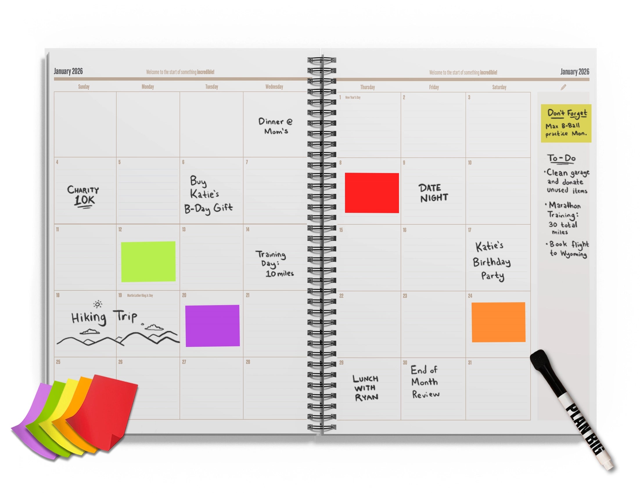 Open planner with colorful sticky notes and a marker on a white background